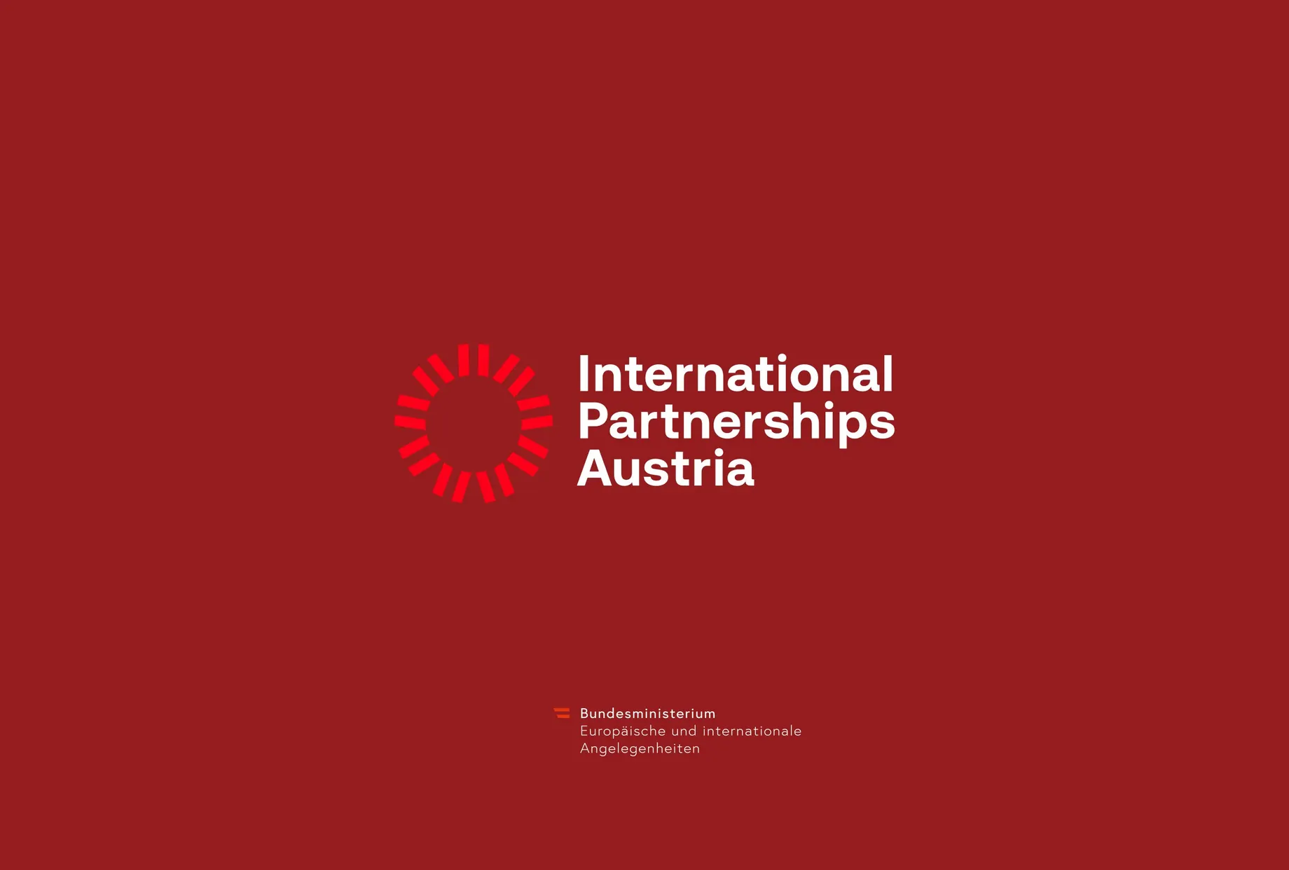 Logo von International Partnerships Austria auf rotem Hintergrund